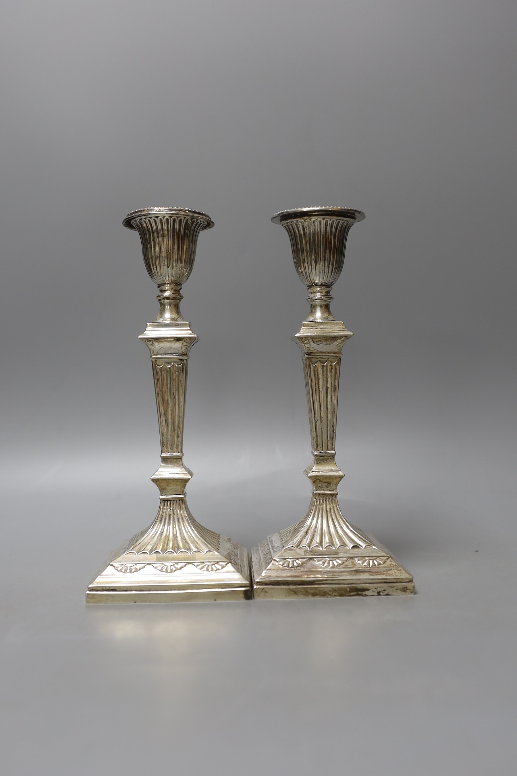 A pair of late Victorian silver candlesticks, by Hawksworth, Eyre & Co, Sheffield, 1894, 21.5cm, weighted.